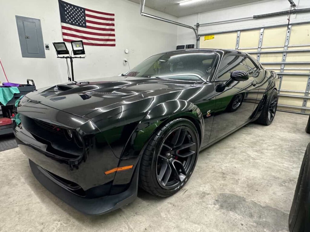 Dodge Challenger Hellcat widebody in garage with American flag