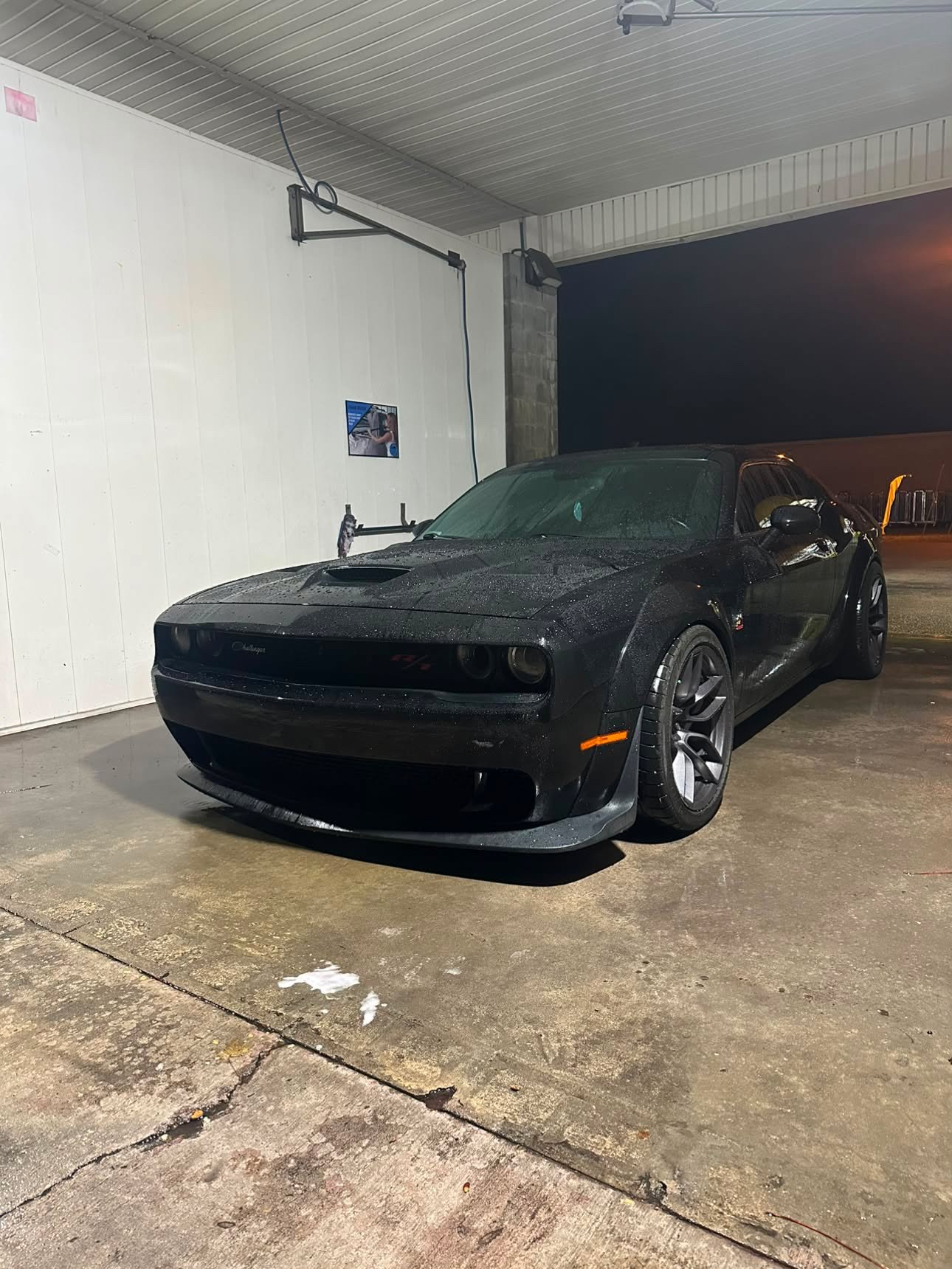 Dodge Challenger Scat Pack Widebody at night in rain