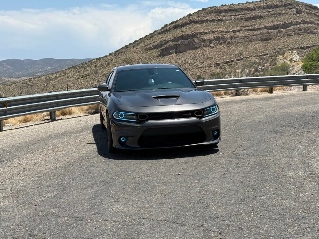 Dodge Charger SRT 392 on desert mountain road with blue halo headlights